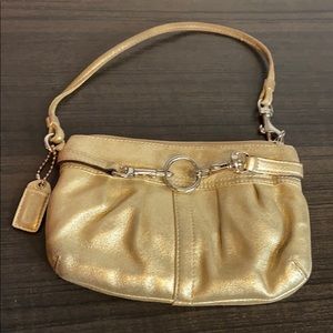 Coach metallic gold wristlet